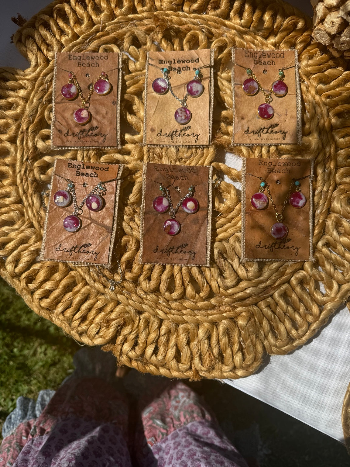 Five Englewood Beach jewelry gift sets on natural woven display